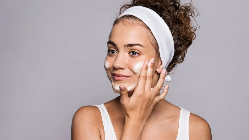 Woman applying skincare cream before a BOTOX® Cosmetic appointment, representing Botox pre-treatment guidelines at Body Scientific Aesthetics.