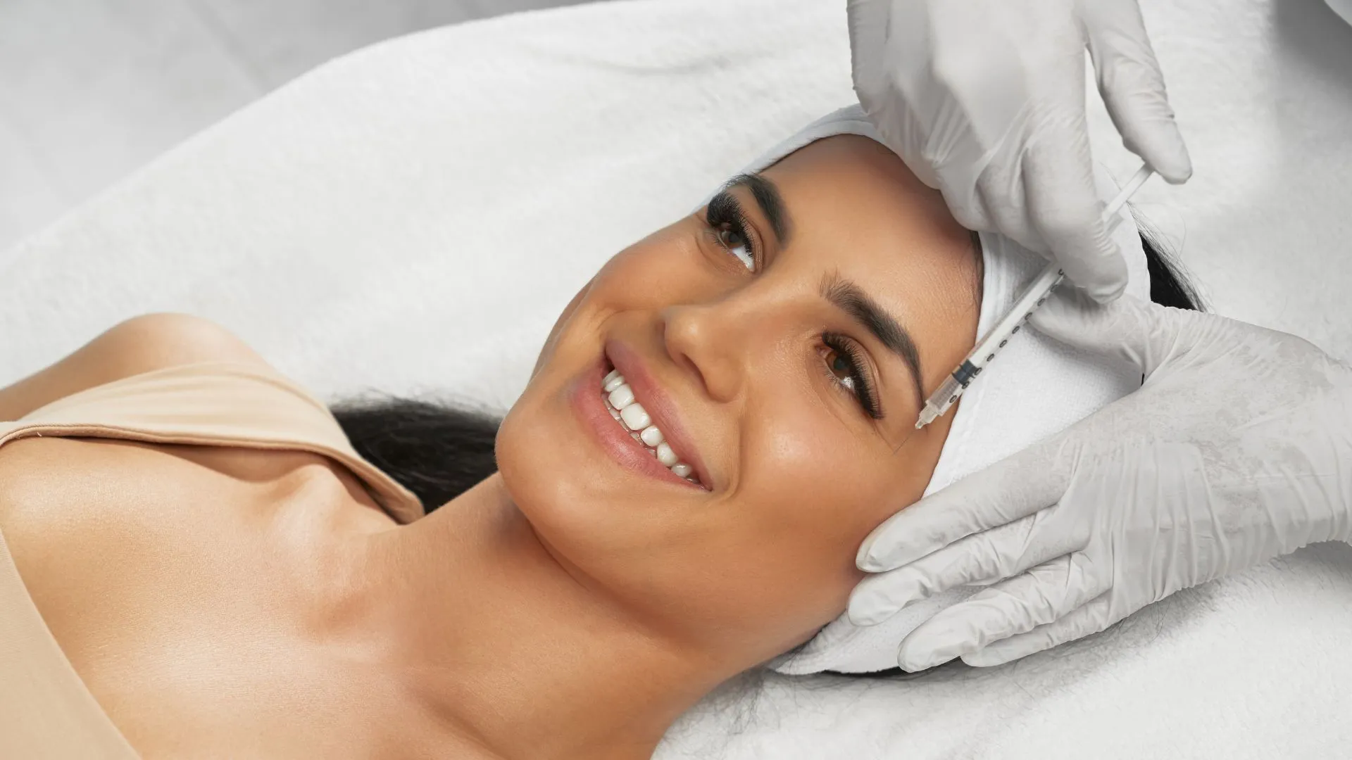 Client receiving a facial injectable treatment for a Botox vs Xeomin comparison near Hunt Valley, Maryland.