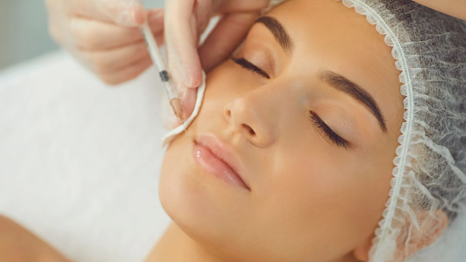 Client receiving a BOTOX® Cosmetic or XEOMIN® injectable treatment for natural-looking facial rejuvenation near White Marsh, Maryland.