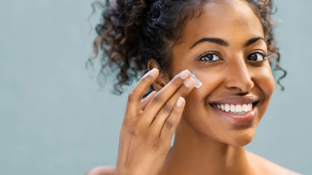 Woman applying skincare cream representing sustainable biotech skincare and science-backed beauty at Body Scientific Aesthetics.
