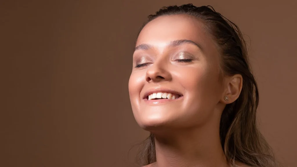 Winter Skin Image for Woman with glowing healthy skin representing winter skin microbiome and barrier-supportive facial care in Timonium, MD
