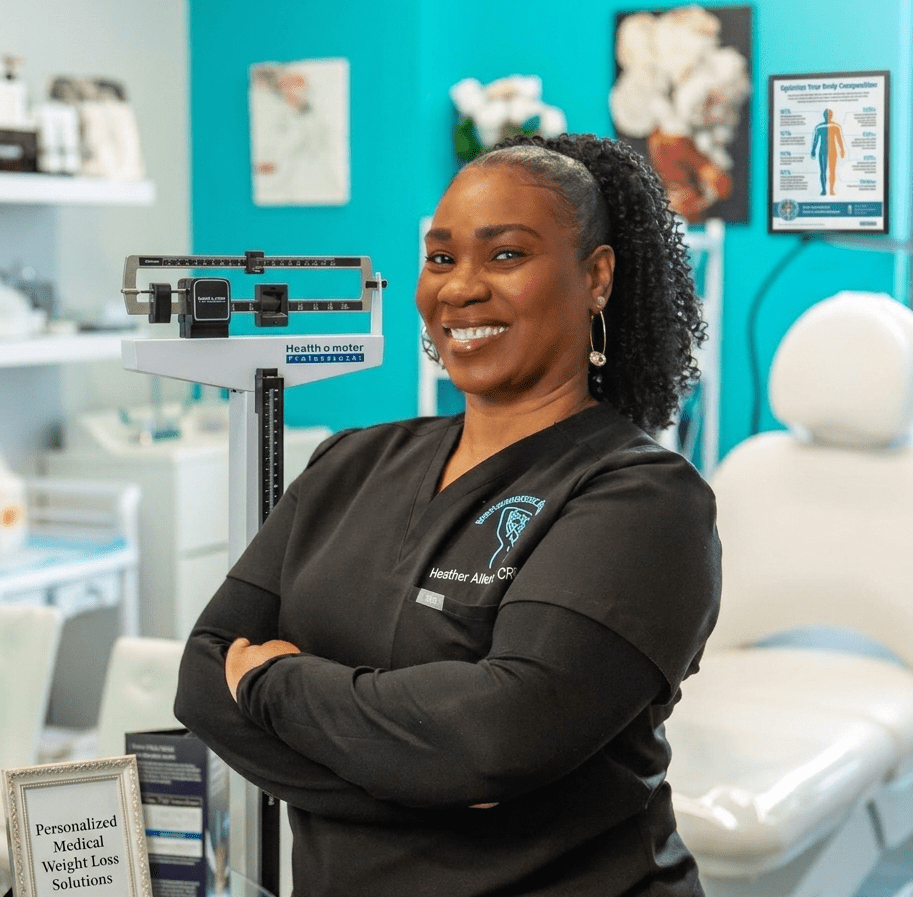 Smiling dental professional confidently standing in a bright clinic.