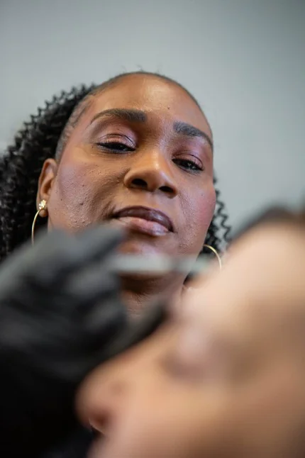 Nurse Practitioner performing a BOTOX® Cosmetic injectable treatment for natural-looking facial rejuvenation in Timonium, Maryland.