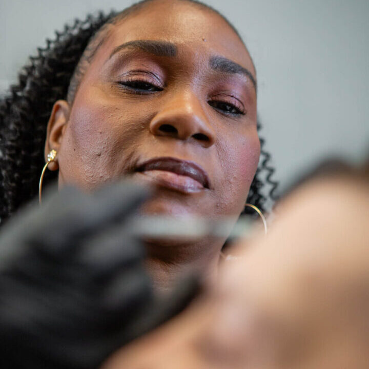 A licensed Nurse Practitioner injector administering a Botox injection to a client's forehead at Body Scientific Aesthetics near Randallstown.