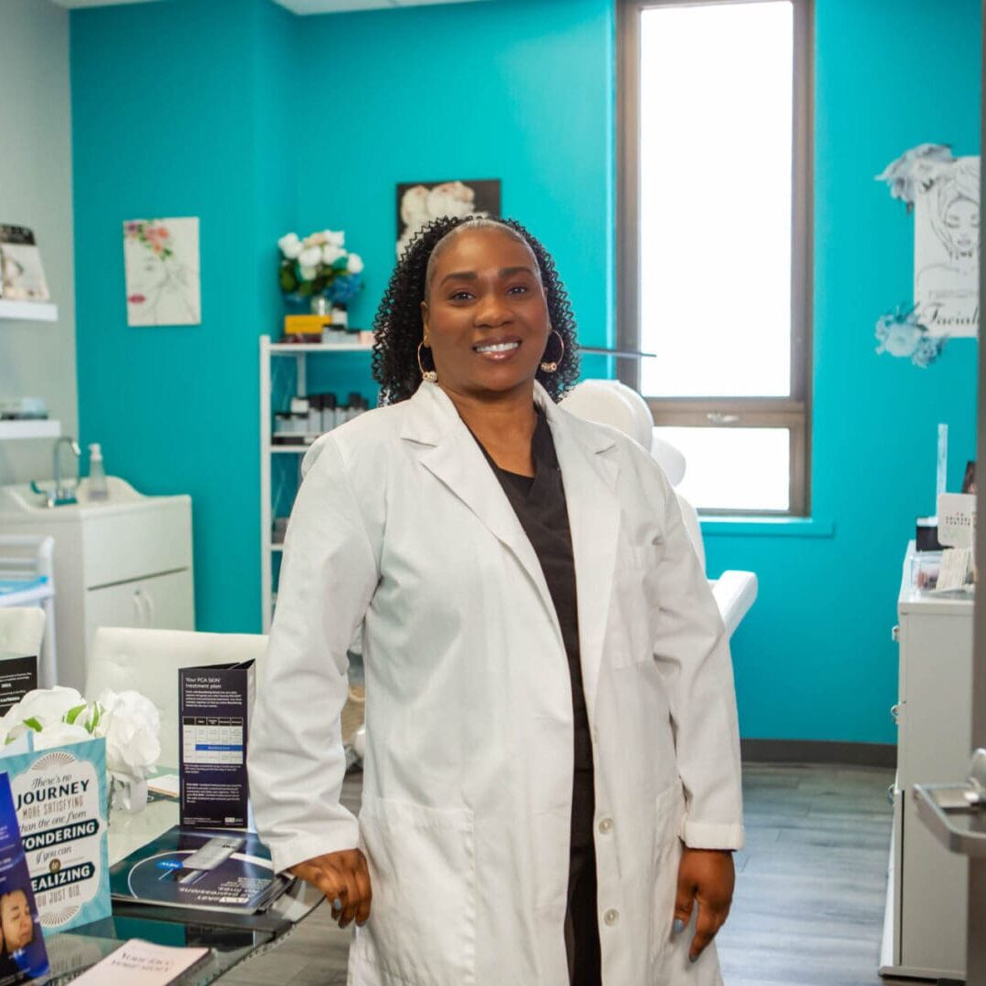 Smiling pharmacist in a bright pharmacy environment.