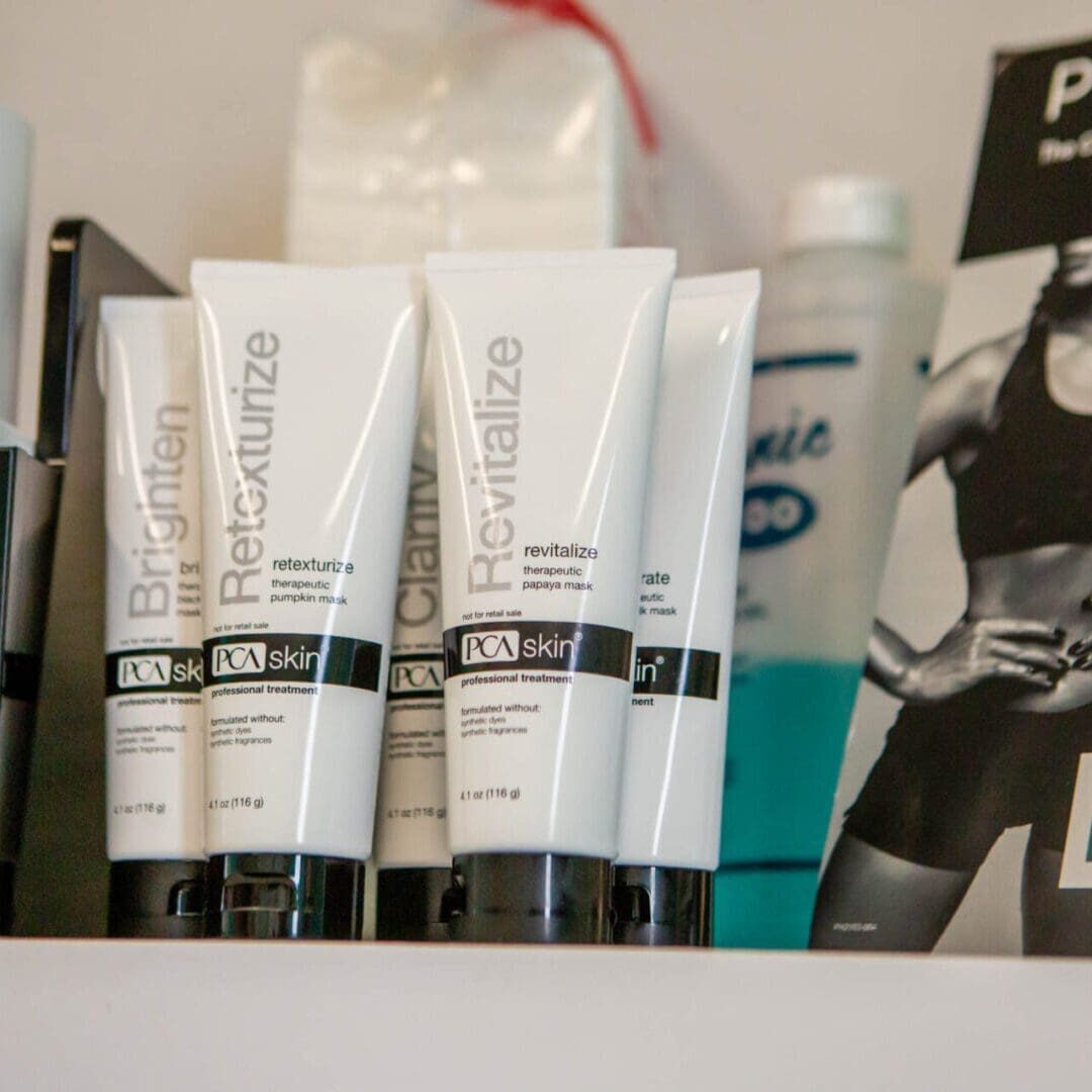 Three tubes of skincare product labeled 'Dermalogica' on a shelf.